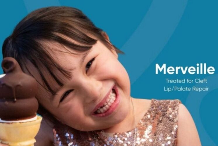 Free Cone Day at Dairy Queen West Bloomfield image of a child holding an ice cream cone for the spring giveaway event.