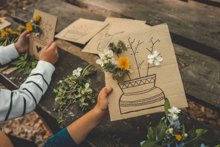 Kids create nature art with flowers and natural materials during Kids Outdoor Craft Hour at Stony Creek Metropark Nature Center