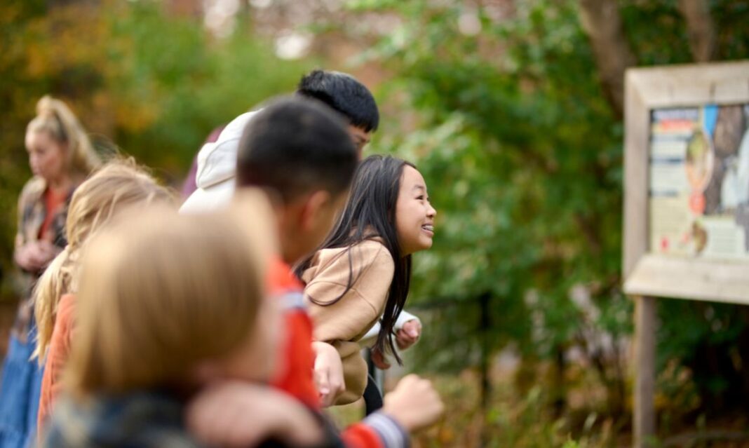 Kids explore a nature center in Lansing during spring break, enjoying outdoor family activities and fresh air in a calm setting