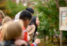 Plan a stress-free spring break in Lansing the whole family will remember Kids explore a nature center in Lansing during spring break, enjoying outdoor family activities and fresh air in a calm setting