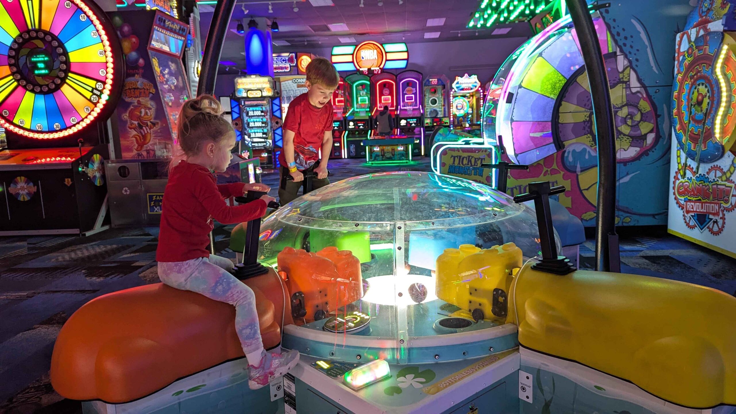 Kids play arcade games at Zap Zone XL in Lansing during spring break, enjoying colorful indoor family fun and interactive entertainment