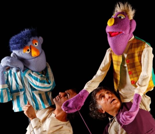 Michigan Wildlife Puppet Play at Nature Center image with colorful puppets and performers during an interactive children's show.