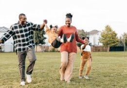 Family enjoying Spring Stroll at Downtown Birmingham with kids walking and playing together outdoors at a fun shopping event