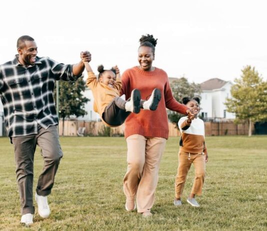 Spring Stroll at Downtown Birmingham Family enjoying Spring Stroll at Downtown Birmingham with kids walking and playing together outdoors at a fun shopping event