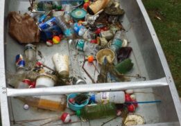 Waterway cleanup and canoe day at Crosswinds Marsh showing collected trash from water to protect wildlife and keep waterways clean