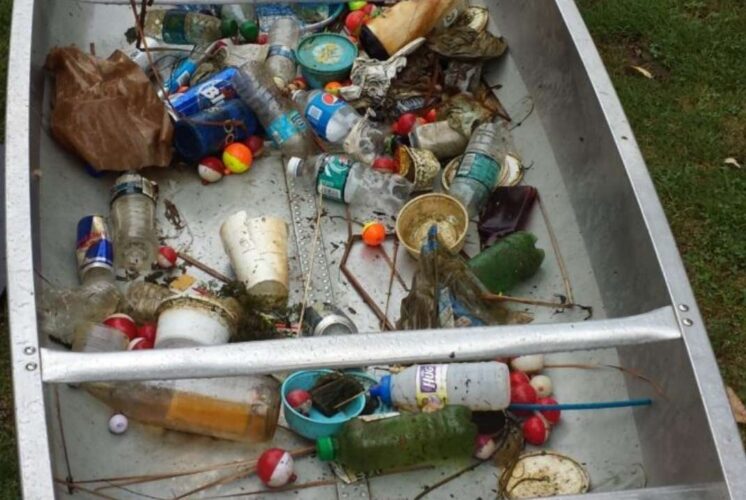 Waterway cleanup and canoe day at Crosswinds Marsh showing collected trash from water to protect wildlife and keep waterways clean