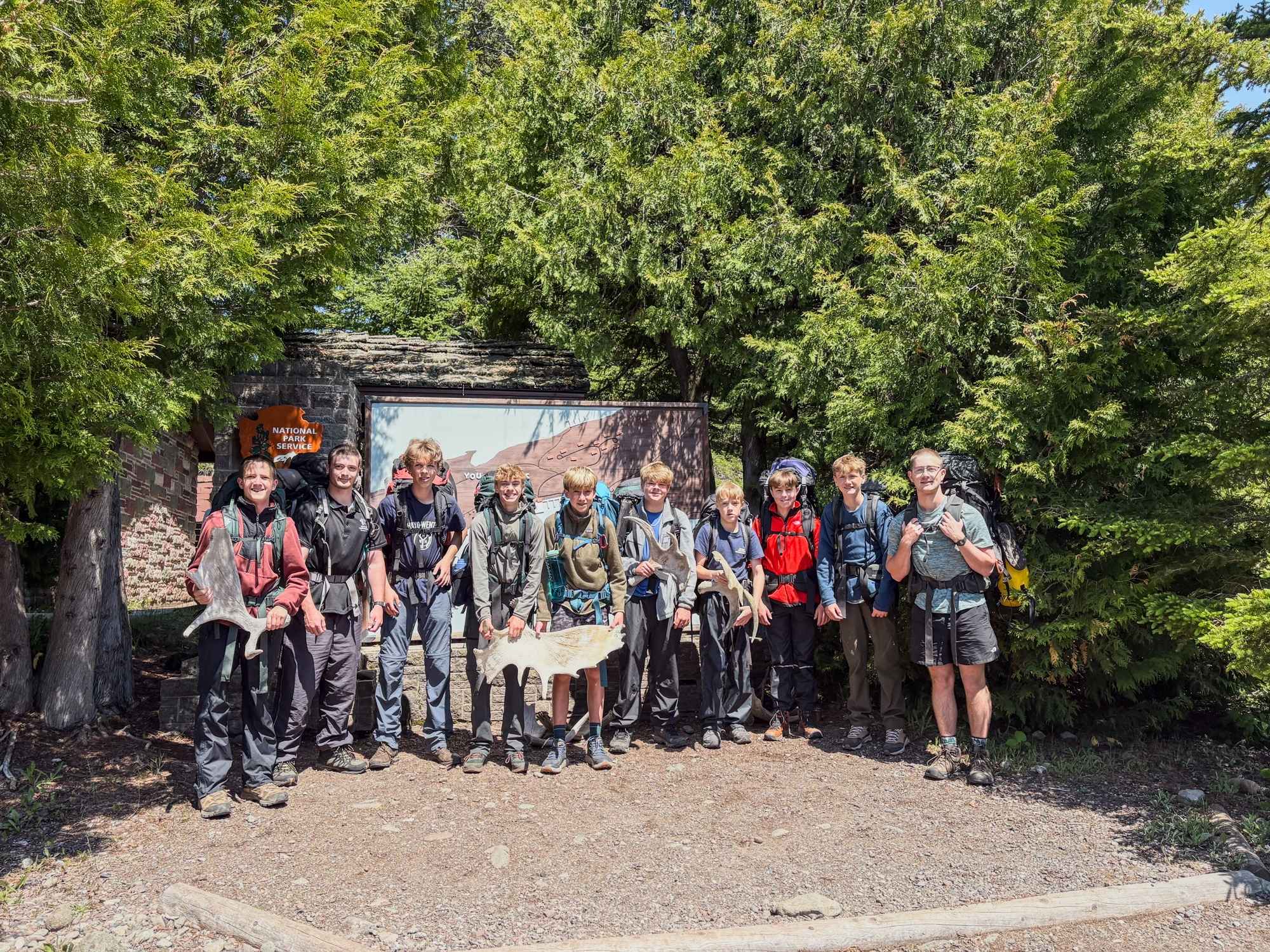 Campers on a wilderness expedition with YMCA Camp Torch Hayo-Went-Ha hike together, building resilience and teamwork in nature