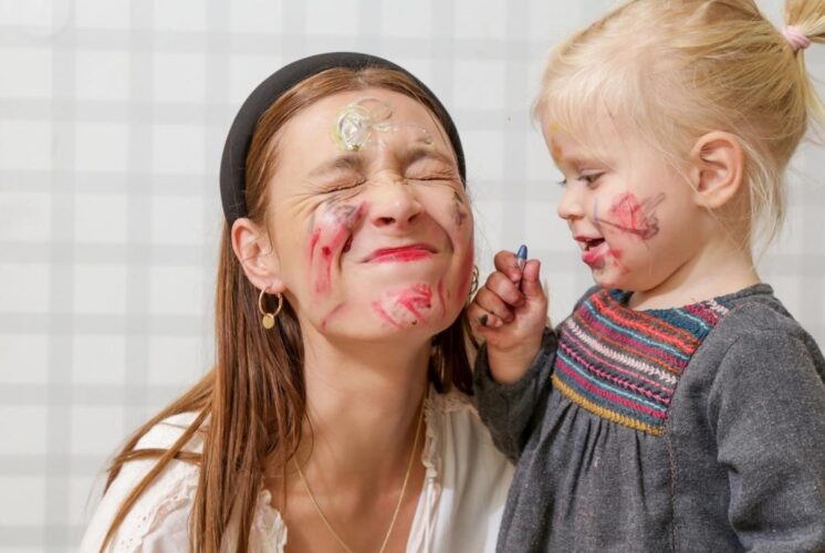 Baby and toddler paint party westacres activity center messy art fun with caregiver and child enjoying hands on painting activity together