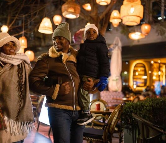 Foolmoon main street ann arbor family lantern night event with glowing lights and families enjoying illuminated parade and festive atmosphere
