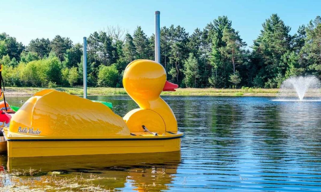 Duck paddle boat on a lake in Muskegon near family-friendly lodging, showcasing fun waterfront activities for kids and parents