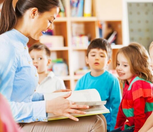 Sensory Friendly Storytime at Shelby Township Library Sensory friendly storytime shelby township library kids reading group with children listening to story in small inclusive setting