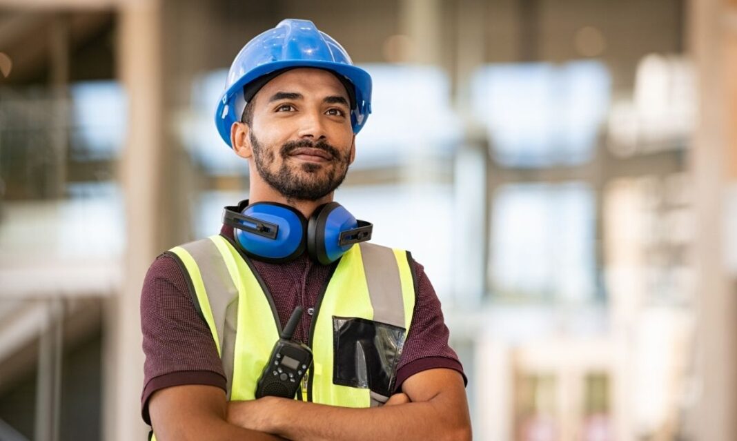 Skilled trades professional wearing safety gear representing career advancement through a short-term certificate leading to a higher degree