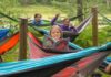 YMCA Camp Timbers builds confidence through connection and outdoor adventure Kids relax in colorful hammocks at YMCA Camp Timbers, an overnight camp on 300 acres of Northern Michigan forest